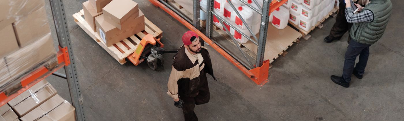 Operations staff working in a large industrial warehouse facility